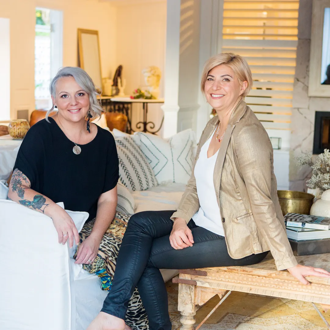 Adrienne Varga and Jodie Fielden, founders of FOCUS, smiling side by side in a bright, styled living room